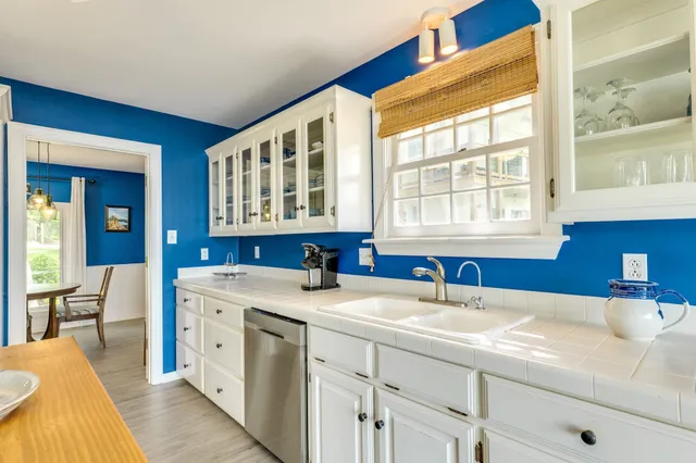 a spacious bathroom with a sink double vanity and a bathtub