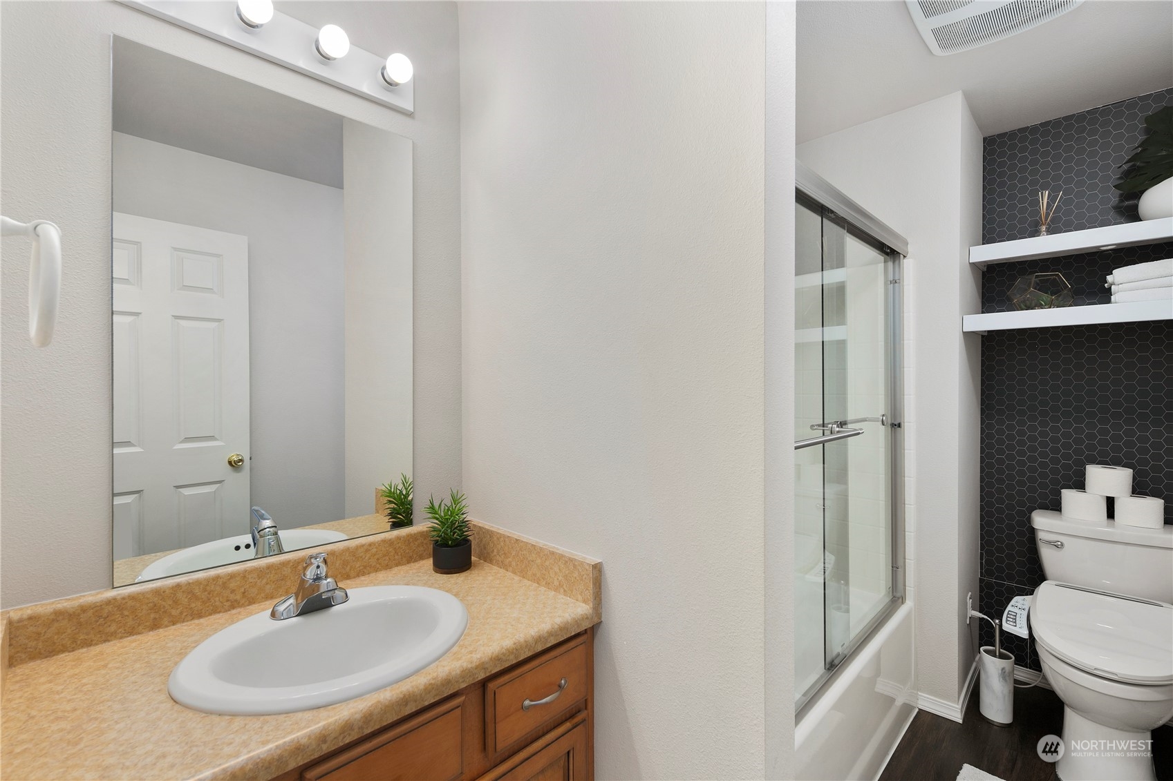 14501 Southeast 154th Street Renton, WA 98058 - Photo 28 of 36 a bathroom with a sink toilet and vanity