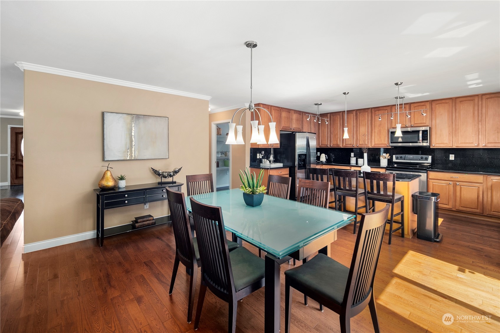 14501 Southeast 154th Street Renton, WA 98058 - Photo 9 of 36 a view of a dining room with furniture and wooden floor