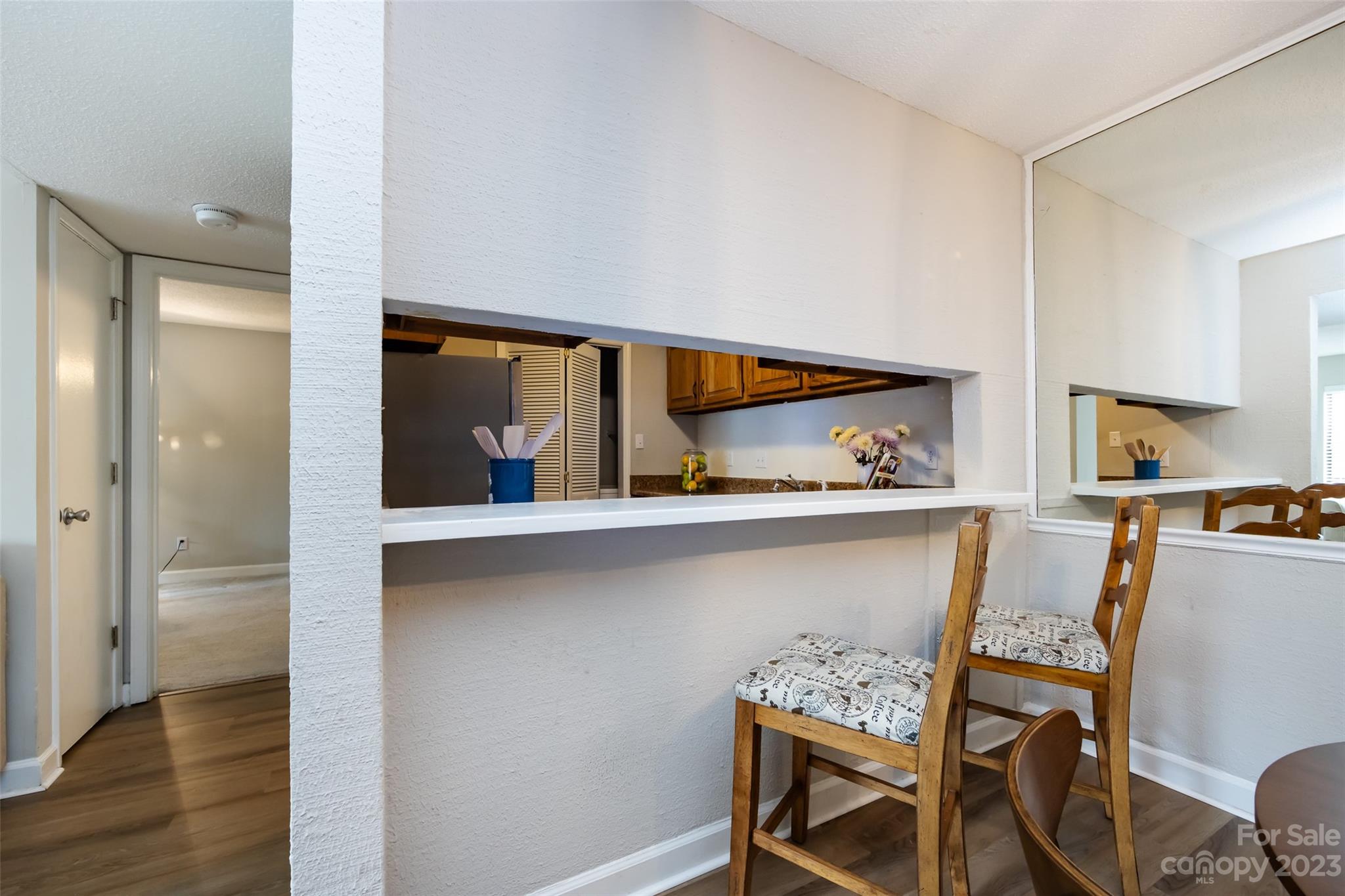 1604 Sharon Road West, Unit 27 Charlotte, NC 28210 - Photo 15 of 28 a view of dining room with furniture and wooden floor
