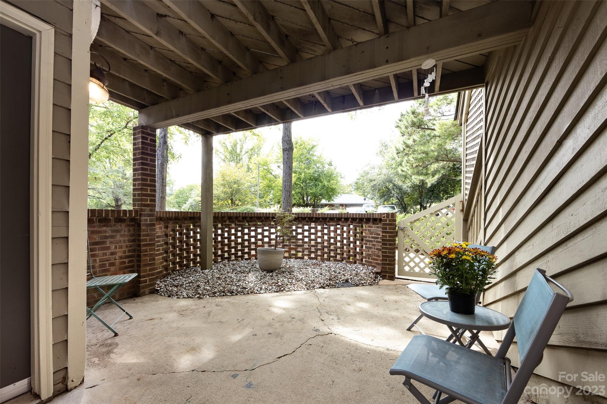 1604 Sharon Road West, Unit 27 Charlotte, NC 28210 - Photo 4 of 28 a balcony view with a garden