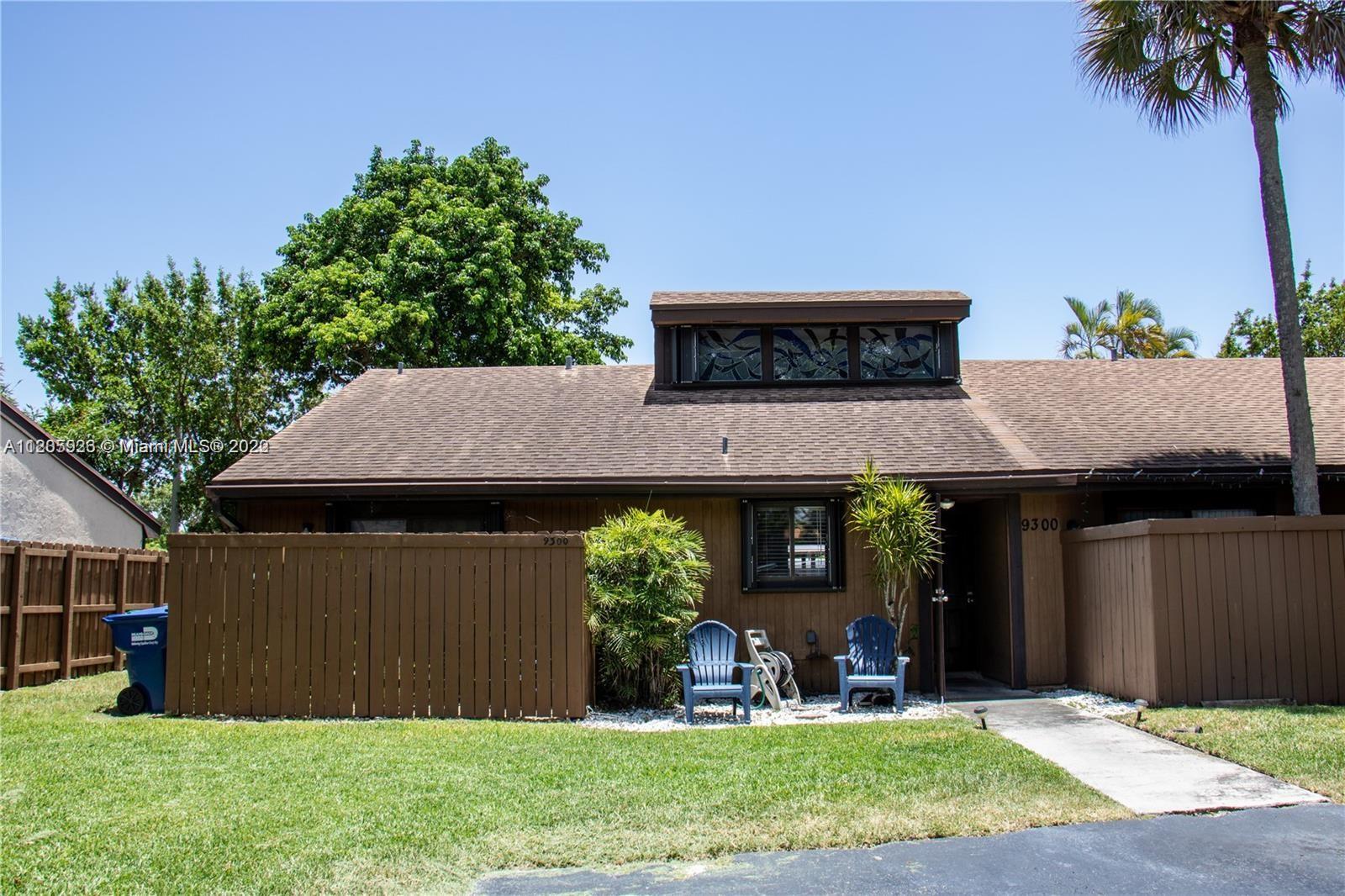 a view of a house with a yard porch and sitting area