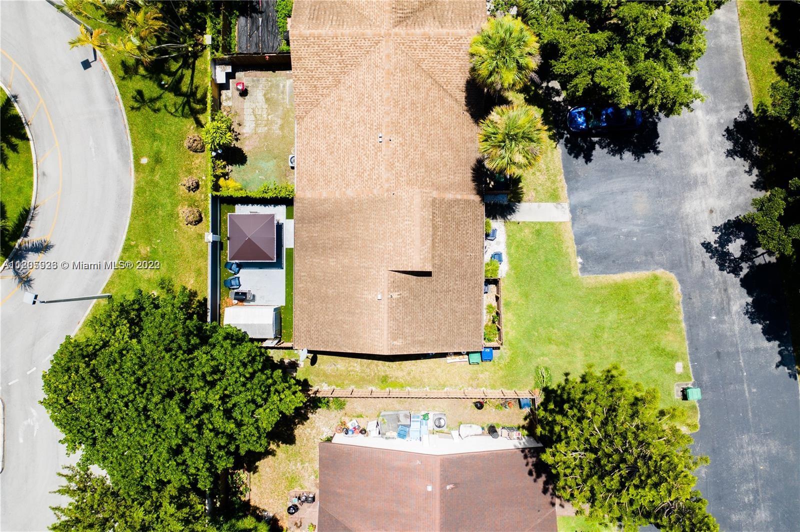9300 Southwest 132nd Street, Unit 9300 Miami, FL 33176 - Photo 12 of 13 an aerial view of a house with a garden
