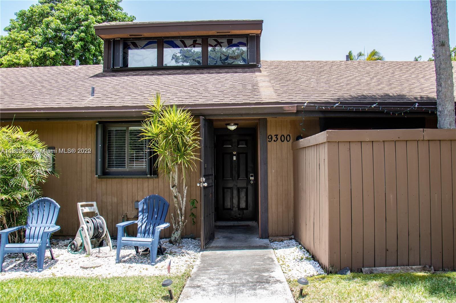 9300 Southwest 132nd Street, Unit 9300 Miami, FL 33176 - Photo 2 of 13 a front view of a house with garden