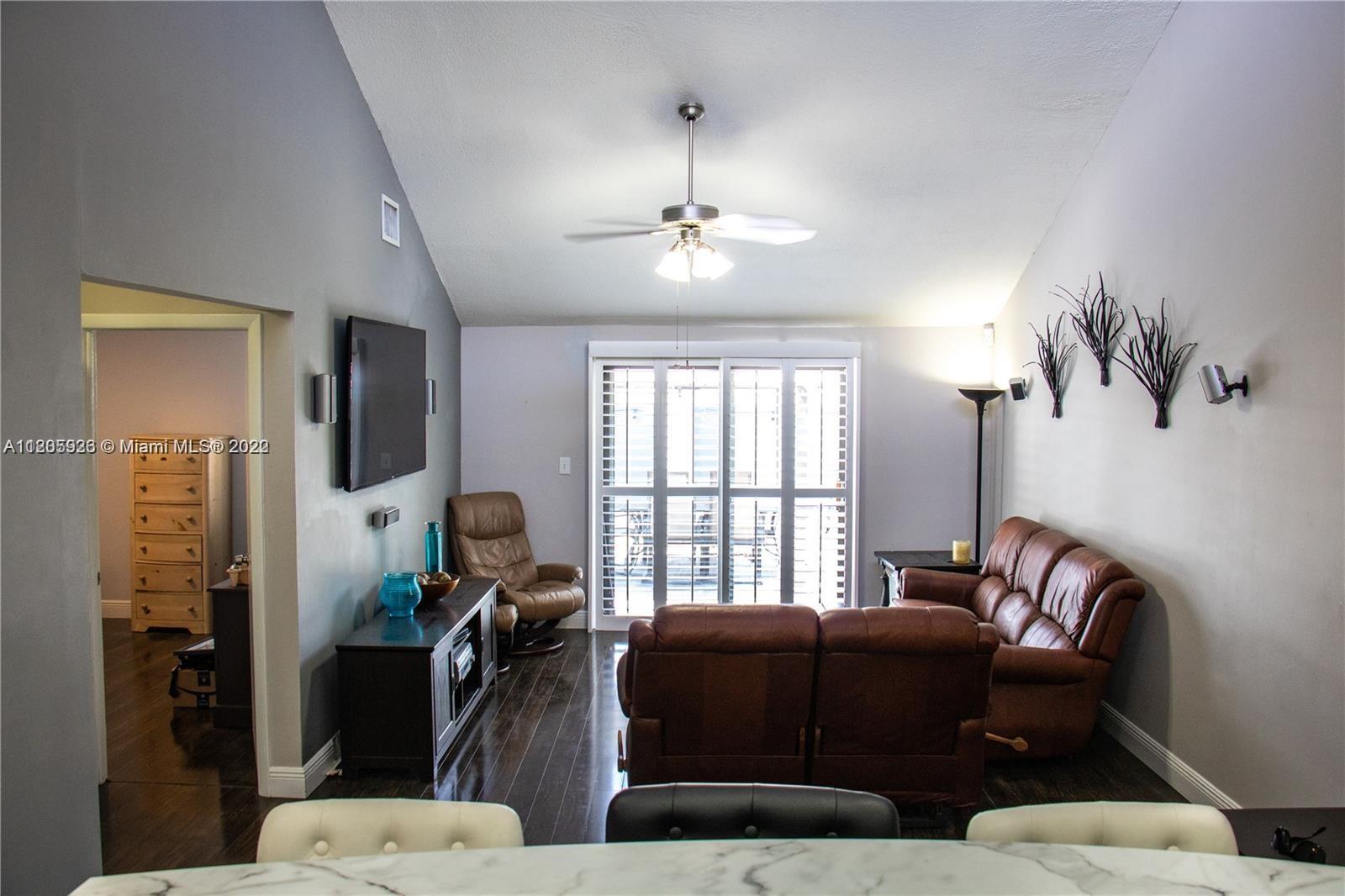 9300 Southwest 132nd Street, Unit 9300 Miami, FL 33176 - Photo 5 of 13 a living room with furniture and a window