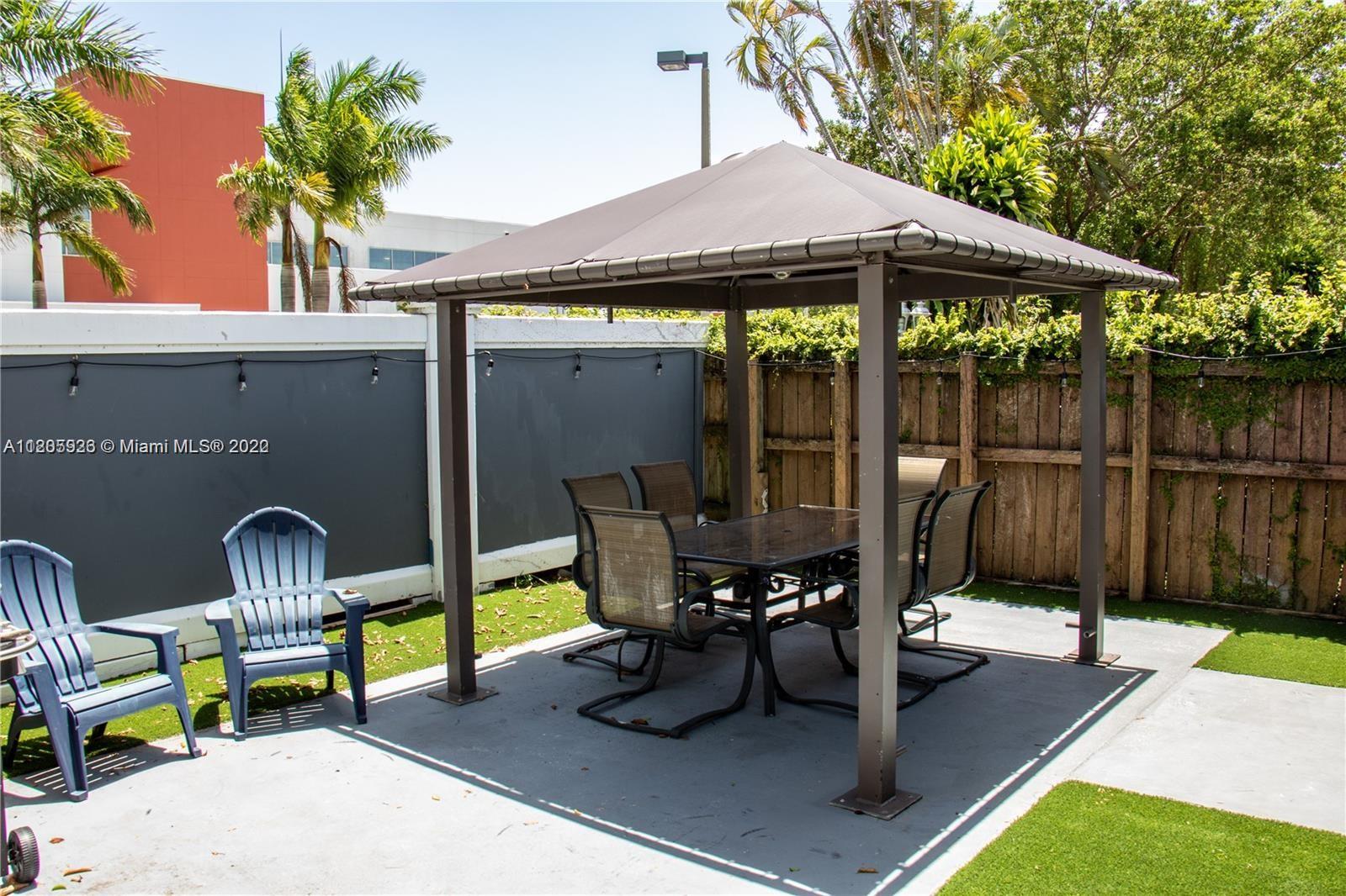 9300 Southwest 132nd Street, Unit 9300 Miami, FL 33176 - Photo 10 of 13 a view of a chairs and tables in the patio