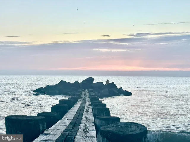 a view of ocean with sunset