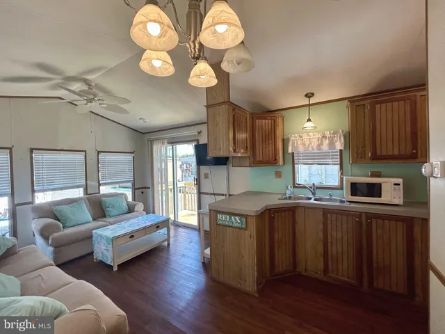 a kitchen with cabinets a sink and appliances