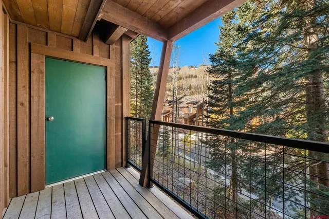 a bathroom with a sink a toilet a mirror a vanity and shower