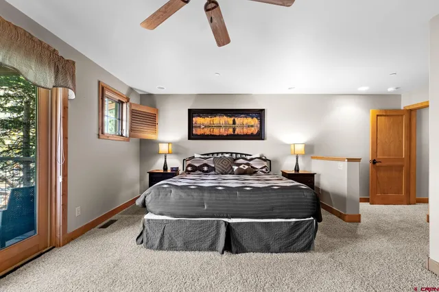 a bedroom with a bed and a fireplace