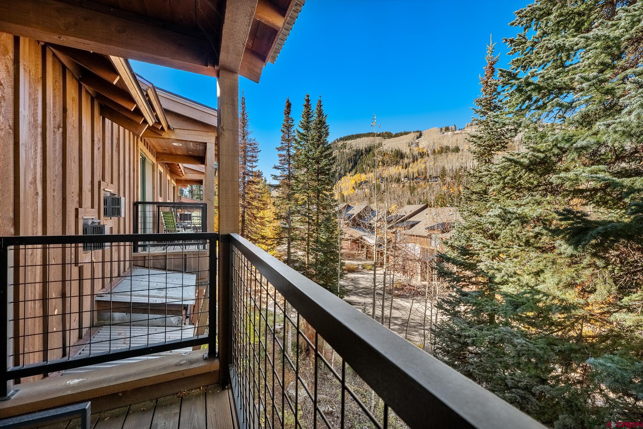 67 Travertine Trail Durango, CO 81301 - Photo 28 of 34 a view of balcony with wooden floor and fence
