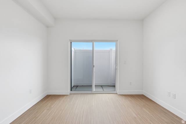 2085 North Main Street, Unit 301 Sunset, UT 84015 - Photo 5 of 20 Living room featuring light wood-style floors and baseboards