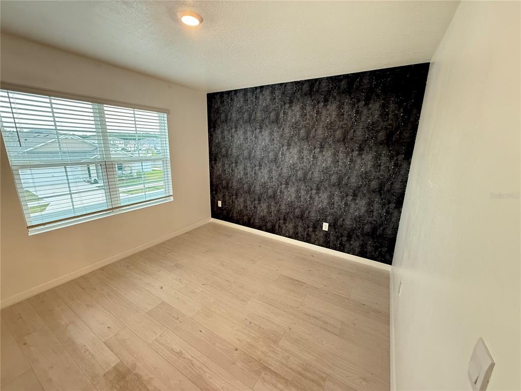 2731 House Finch Road Harmony, FL 34773 - Photo 34 of 95 a view of an empty room with a window