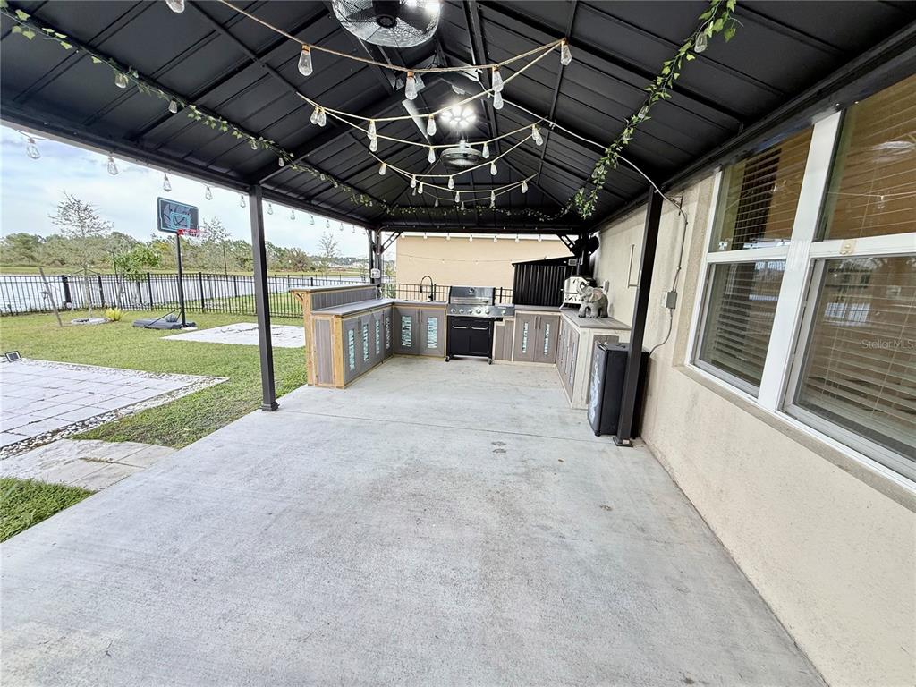 2731 House Finch Road Harmony, FL 34773 - Photo 56 of 95 a view of a porch with furniture