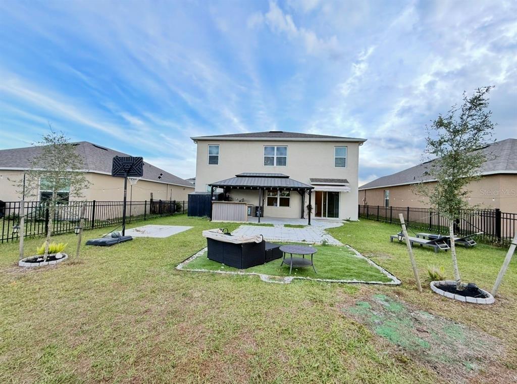 2731 House Finch Road Harmony, FL 34773 - Photo 65 of 95 a view of a house with backyard and a tree