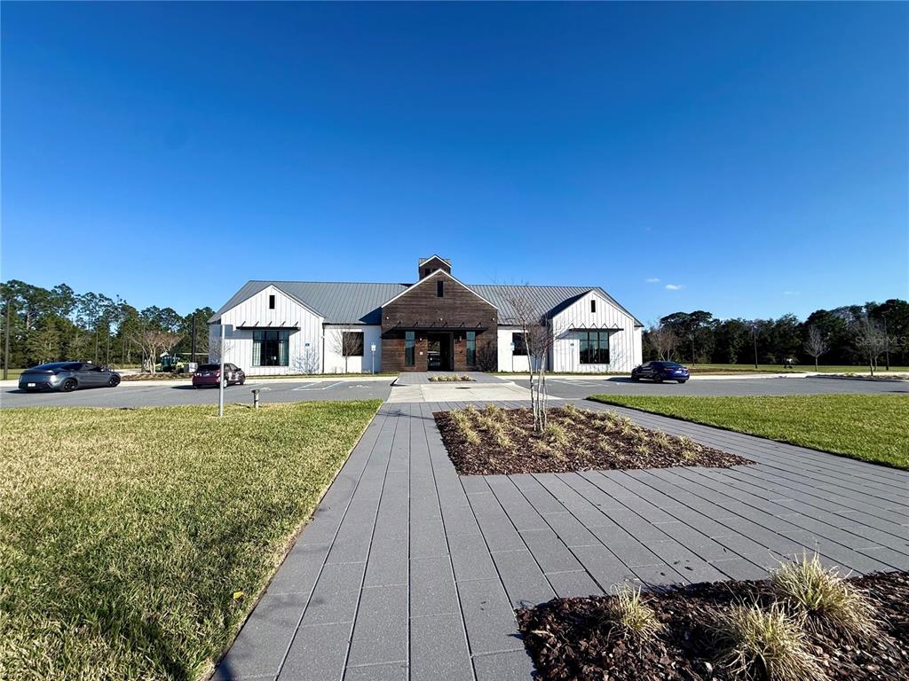 2731 House Finch Road Harmony, FL 34773 - Photo 74 of 95 a front view of a house with garden