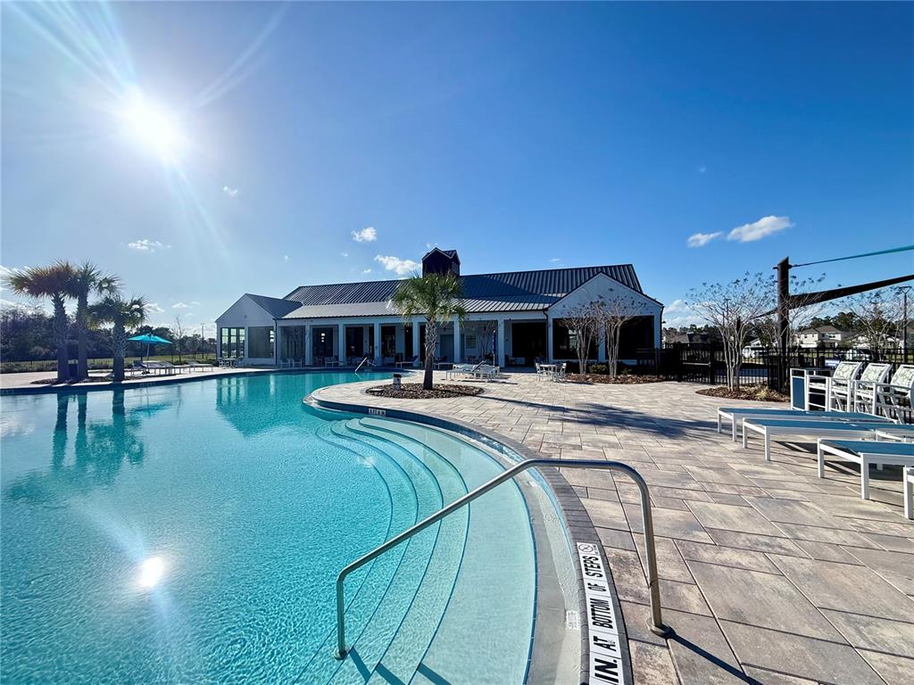 2731 House Finch Road Harmony, FL 34773 - Photo 95 of 95 a swimming pool view with a outdoor seating