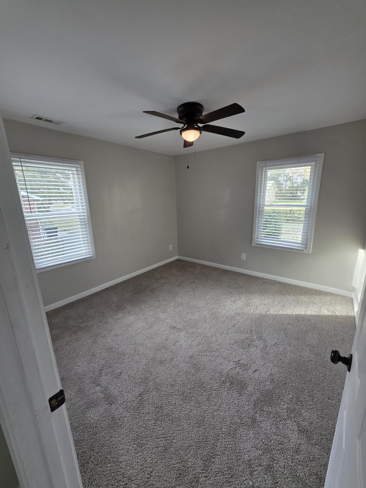 602 Johnson Street Murfreesboro, TN 37130 - Photo 17 of 28 an empty room with windows and fan