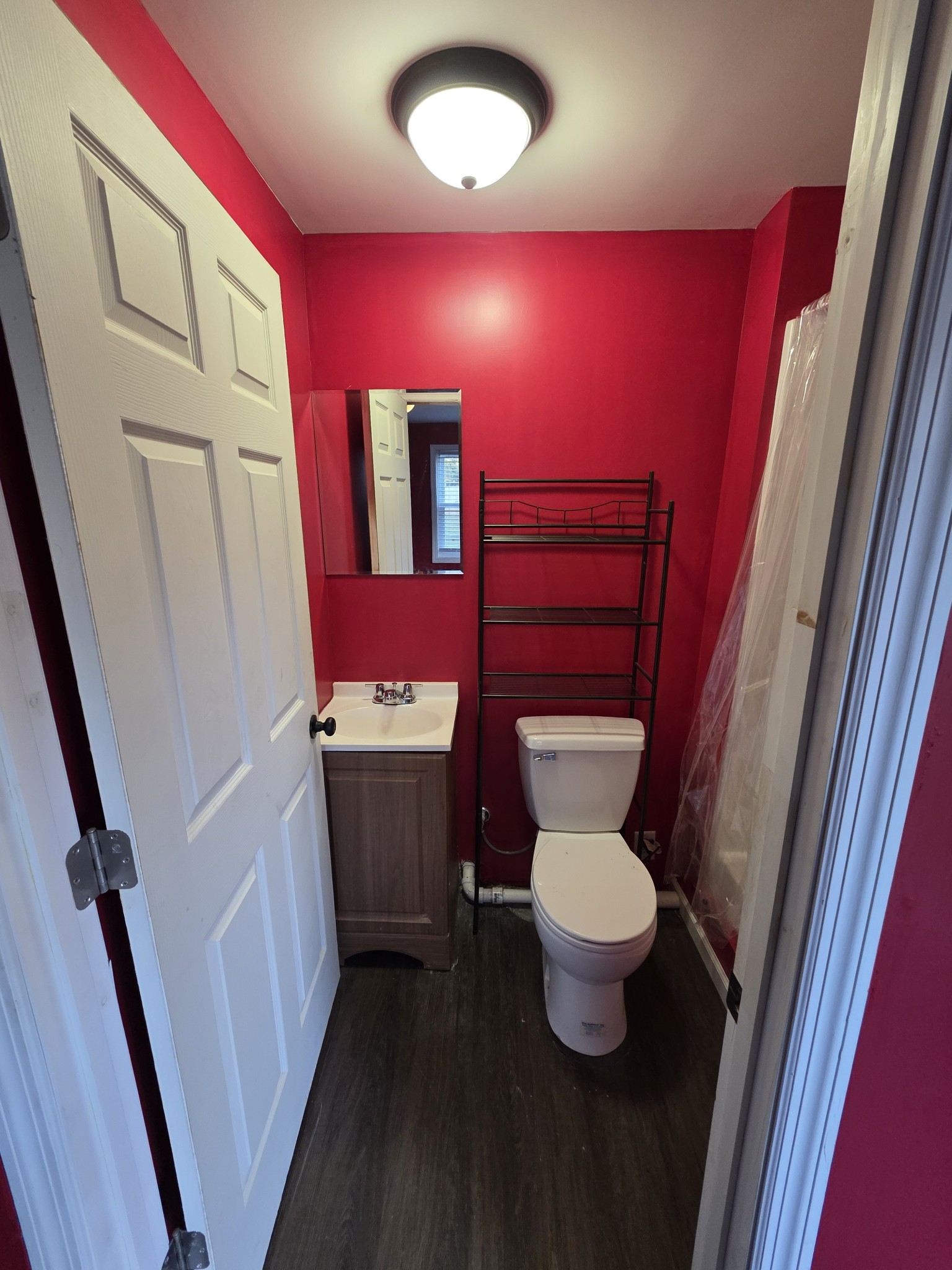 602 Johnson Street Murfreesboro, TN 37130 - Photo 25 of 28 a bathroom with a toilet sink and a mirror
