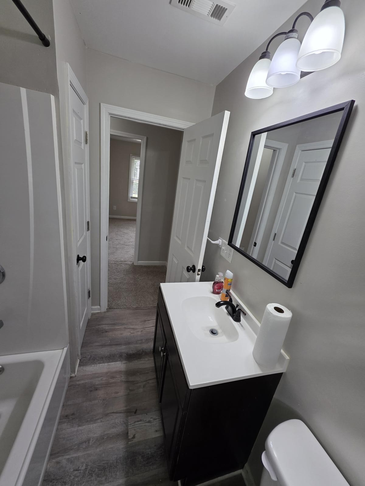 602 Johnson Street Murfreesboro, TN 37130 - Photo 10 of 28 a bathroom with a sink a toilet and shower