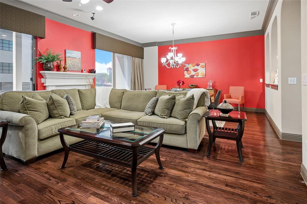 835 Rockingham Drive Irving, TX 75063 - Photo 6 of 27 a living room with furniture a flat screen tv and a wooden floor