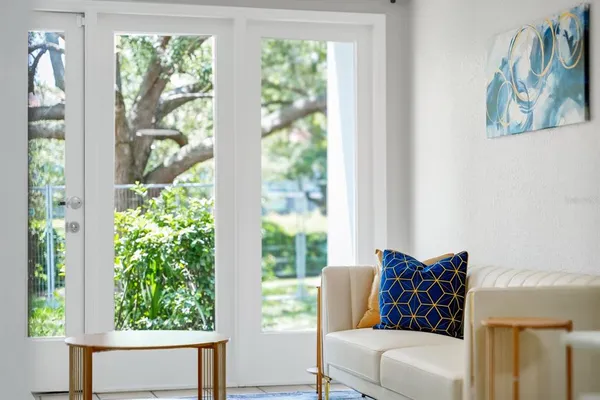 a living room with furniture and a large window