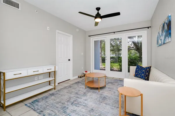 a living room with furniture and a window