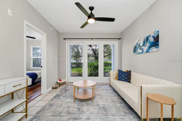 a living room with furniture and a large window