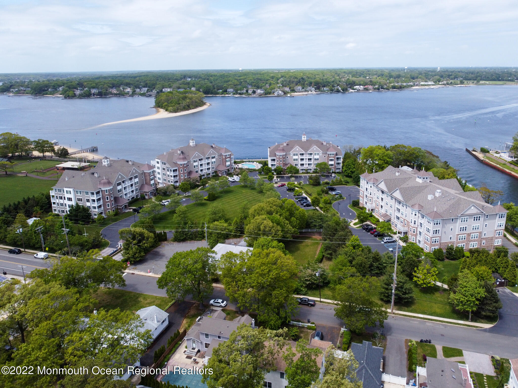 2201 River Road, Unit 4203 Point Pleasant, NJ 08742 - Photo 1 of 30 an aerial view of a houses with outdoor space and lake view