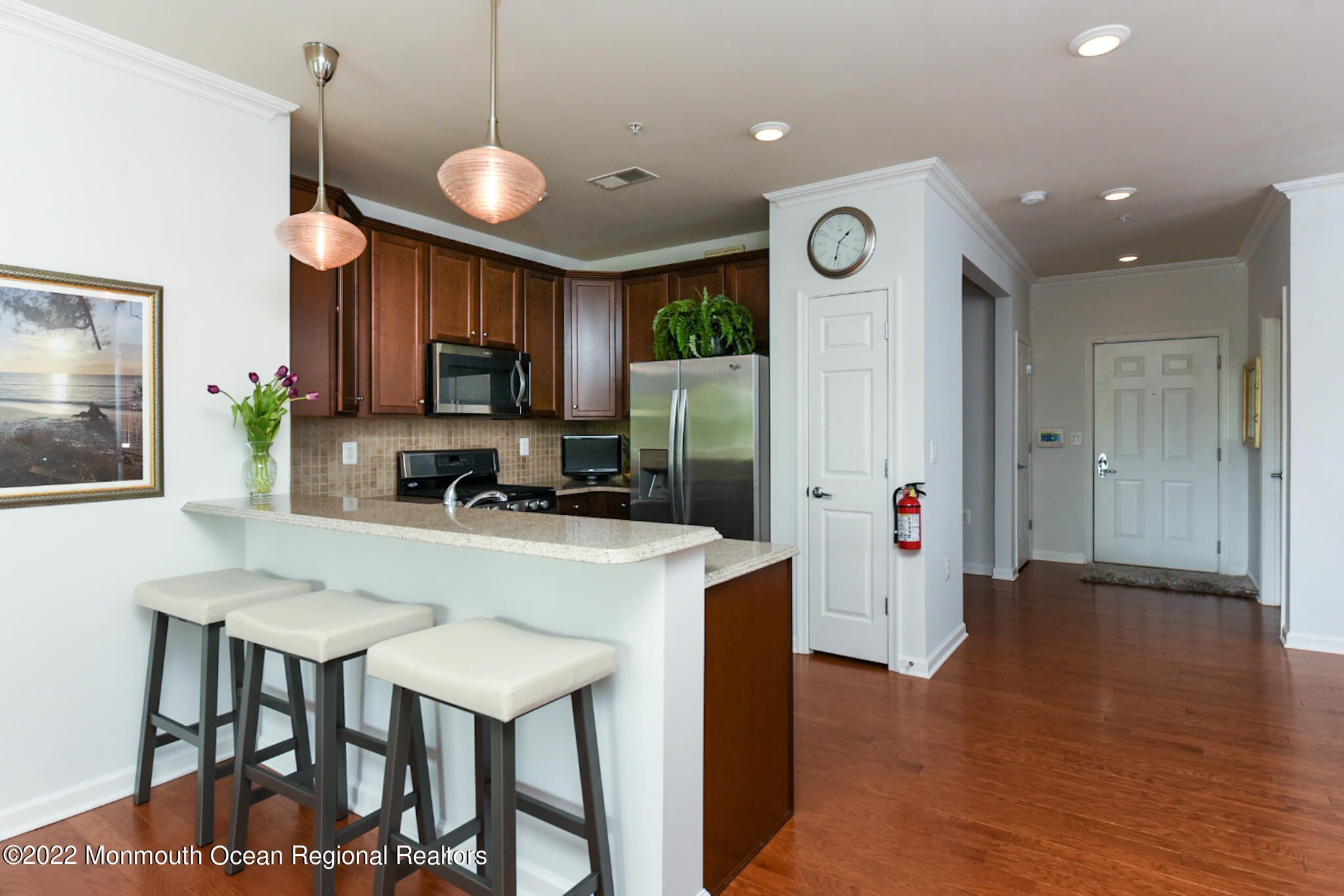 2201 River Road, Unit 4203 Point Pleasant, NJ 08742 - Photo 9 of 30 a kitchen with a table and chairs in it