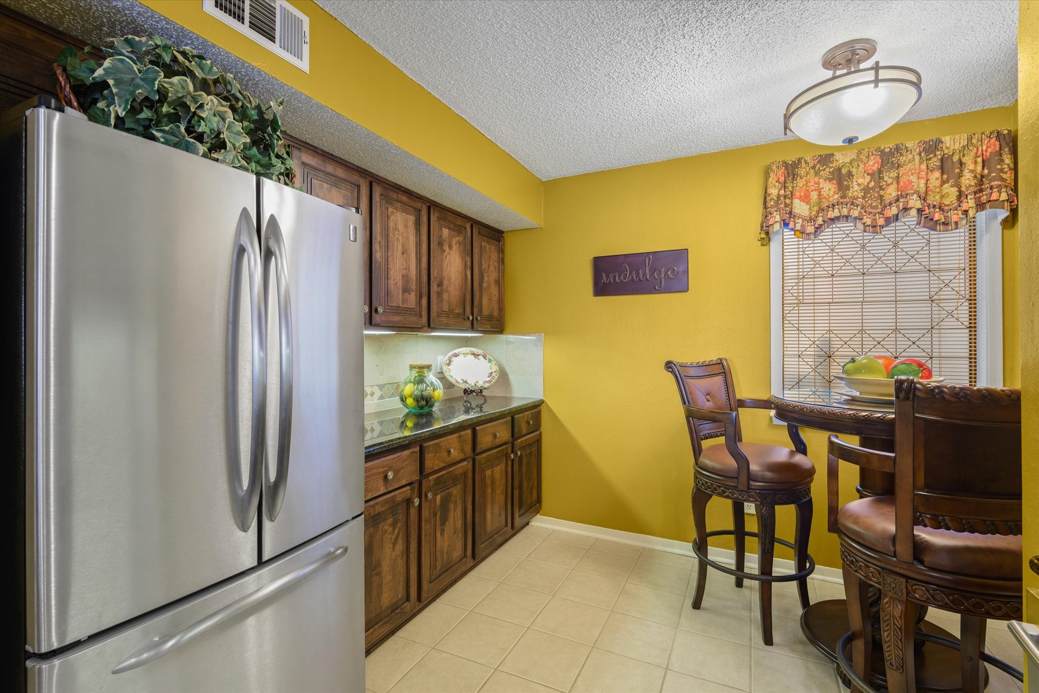 18 Antilles Lane Nassau Bay, TX 77058 - Photo 11 of 44 a kitchen with stainless steel appliances granite countertop a refrigerator and a stove top oven