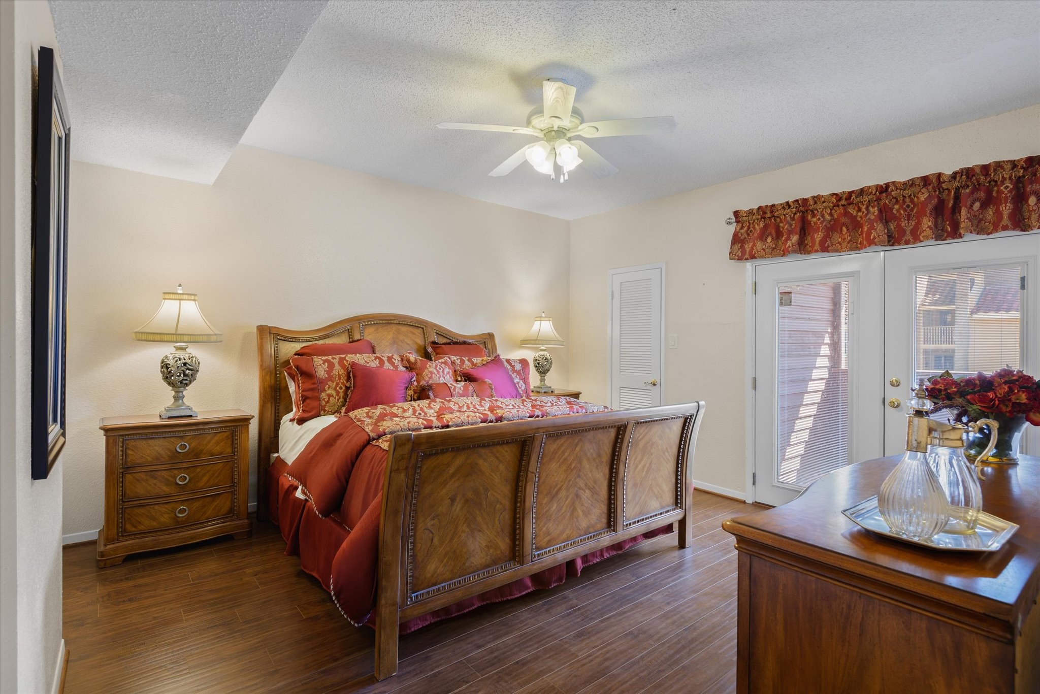 18 Antilles Lane Nassau Bay, TX 77058 - Photo 13 of 44 a bedroom with a bed and a chandelier