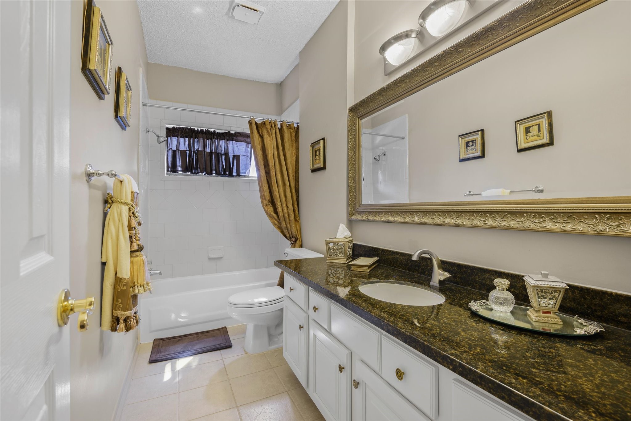 18 Antilles Lane Nassau Bay, TX 77058 - Photo 14 of 44 a bathroom with a granite countertop bathtub sink vanity mirror and toilet