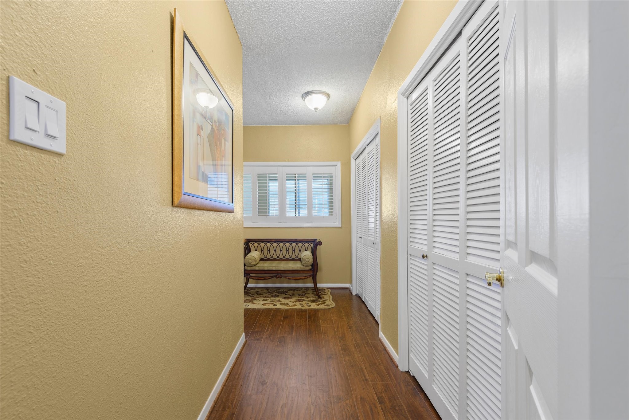 18 Antilles Lane Nassau Bay, TX 77058 - Photo 16 of 44 a view of a hallway with wooden floor and a bathroom