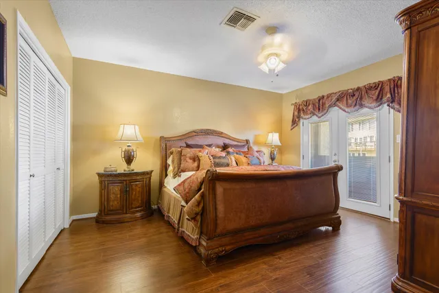 a view of a room with wooden floor and white walls