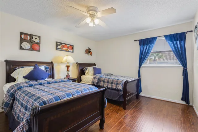 a view of a lake with a building and a yard in the back