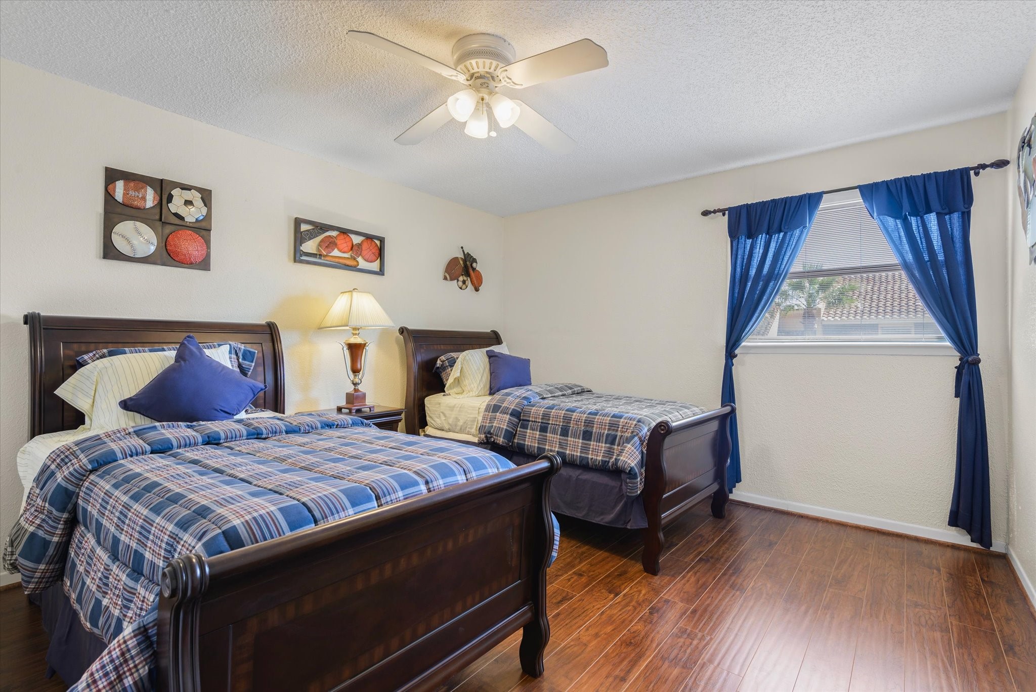 18 Antilles Lane Nassau Bay, TX 77058 - Photo 22 of 44 a bedroom with a bed and a chandelier