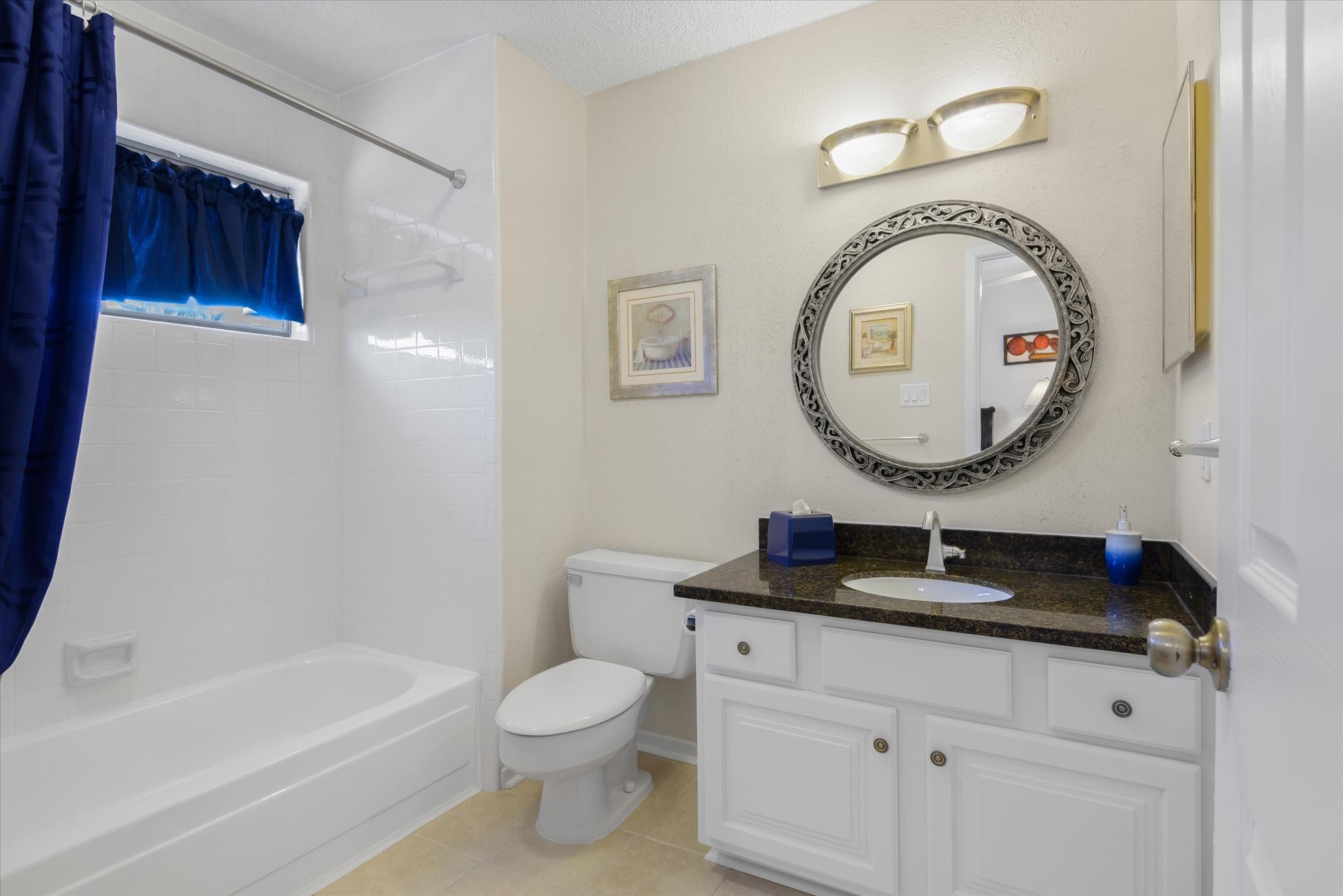 18 Antilles Lane Nassau Bay, TX 77058 - Photo 23 of 44 a bathroom with a sink a mirror and a toilet