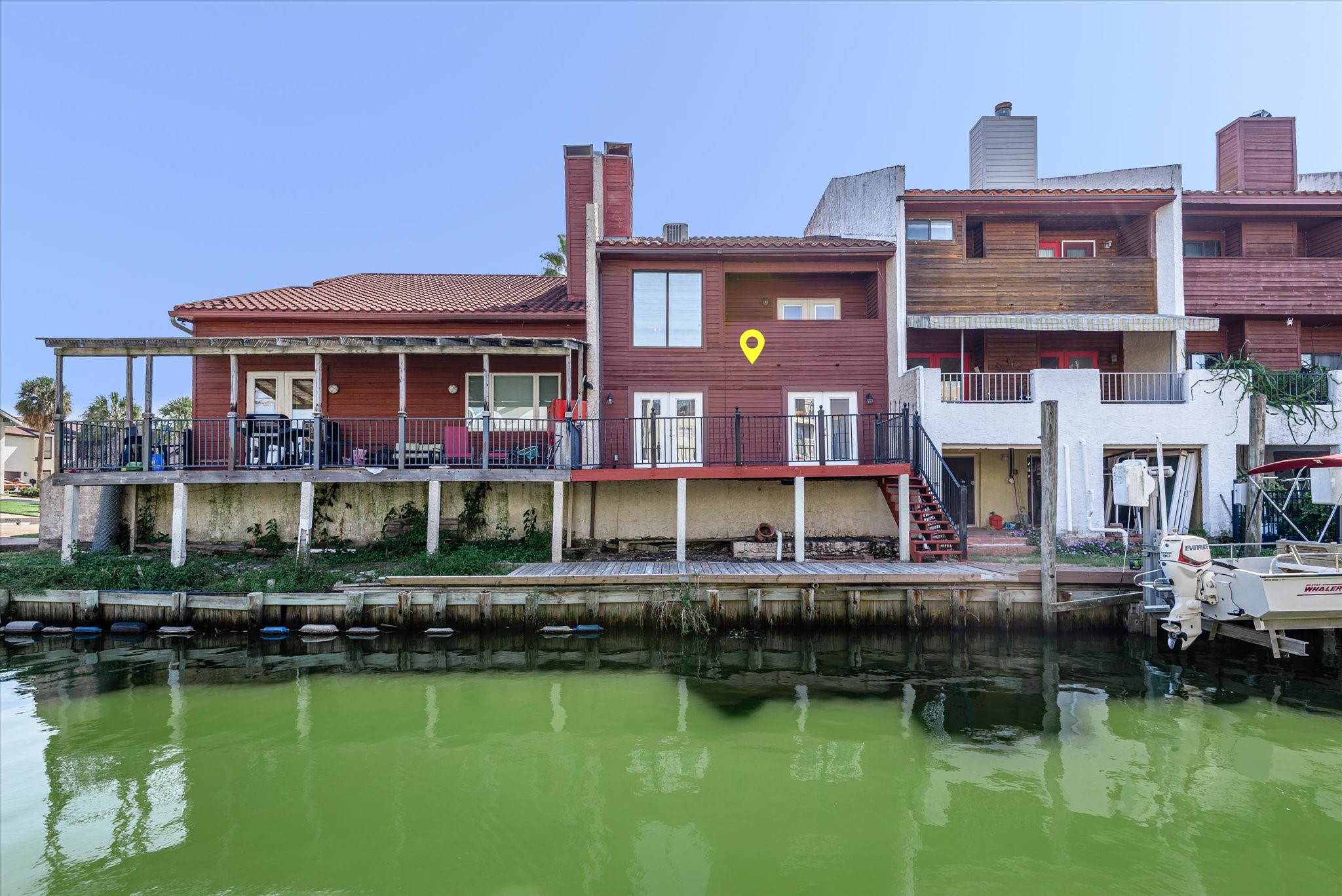 18 Antilles Lane Nassau Bay, TX 77058 - Photo 28 of 44 a large body of water next to a building with large trees and boats