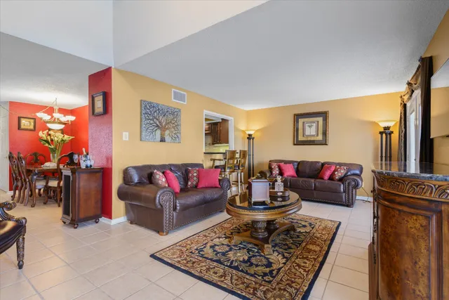a living room with furniture and a rug