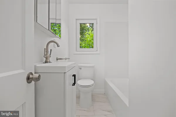 a bathroom with a sink and a toilet