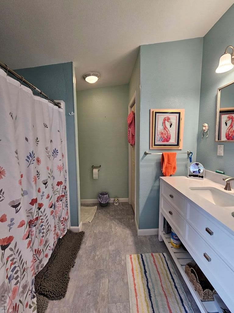 1302 Rittgers Street Eads, CO 81036 - Photo 11 of 29 a room with a sink and a mirror