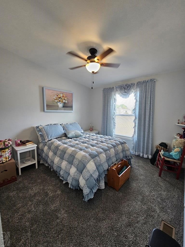 1302 Rittgers Street Eads, CO 81036 - Photo 15 of 29 a bedroom with a bed and a chandelier