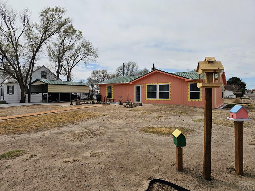 1302 Rittgers Street Eads, CO 81036 - Photo 20 of 29 a front view of a house with a yard