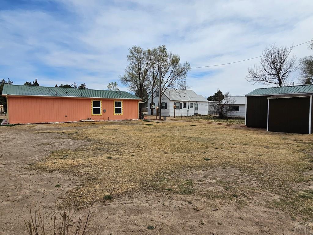 1302 Rittgers Street Eads, CO 81036 - Photo 28 of 29 a view of a house with a yard