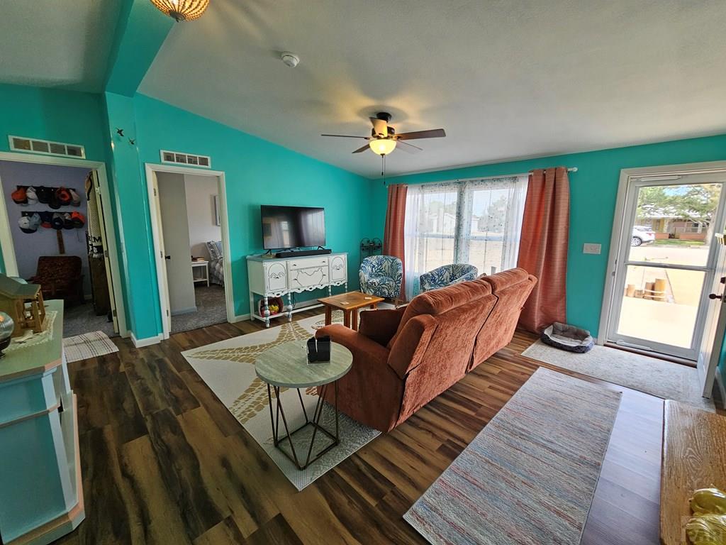 1302 Rittgers Street Eads, CO 81036 - Photo 3 of 29 a living room with furniture a flat screen tv and a large window