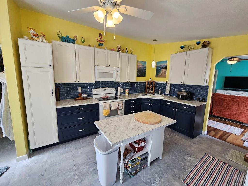 1302 Rittgers Street Eads, CO 81036 - Photo 5 of 29 a kitchen with a sink and a stove top oven