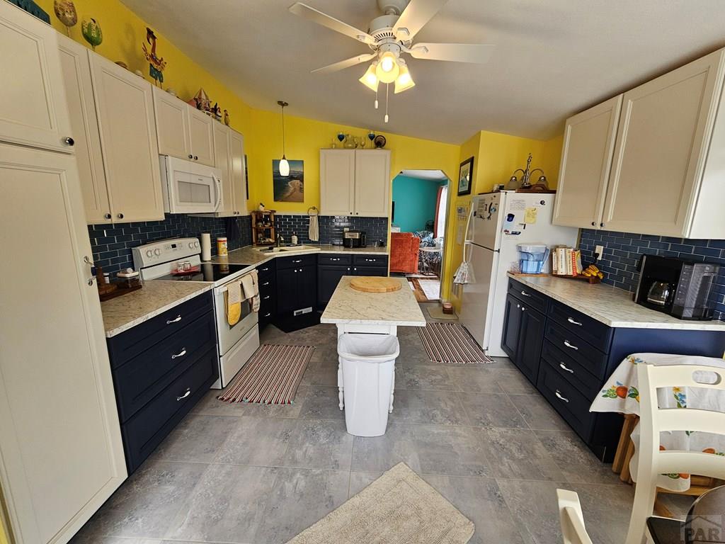 1302 Rittgers Street Eads, CO 81036 - Photo 6 of 29 a kitchen with a sink stove and refrigerator