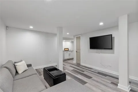 a bedroom with a bed and a night stand