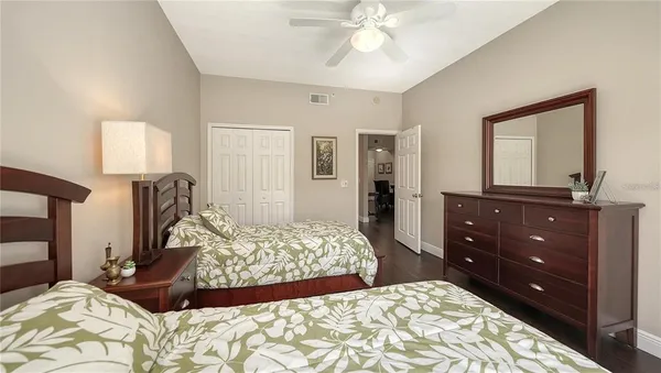 a bedroom with a bed and a dresser